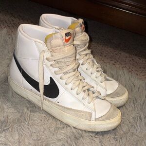 Nike White and Black High-Top Sneakers with Orange Logo Accent
